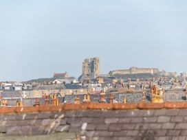A view of rooftops and a castle in the background at 22 Ashville Avenue, Scarborough