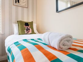 A bedroom with a bed and decorative pillow at The Ravines in Scarborough