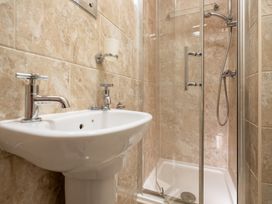 A bathroom with a sink and shower at The Ravines in Scarborough