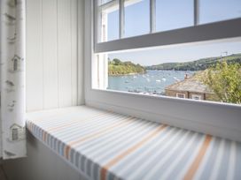 A window overlooking a sea view at Primrose Cottage in Salcombe