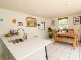 A kitchen with a dining area and table at Manning's View in Barnstaple