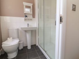 A bathroom with a shower and sink at Manning's View in Barnstaple