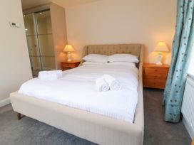 A bedroom with a bed and bedside tables at Manning's View in Barnstaple
