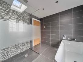 A bathroom with a bathtub and shower at Abergele