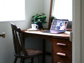 A home office with a desk and laptop at Beautiful 6Bed Sleeps 12 Stunning Views in Lynton