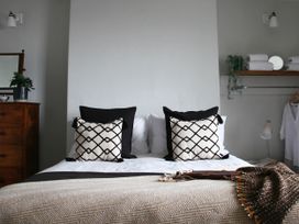 A bedroom with a bed and dresser at Beautiful 6Bed Sleeps 12 Stunning Views in Lynton