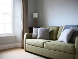 A living room with a sofa and lamp at Beautiful 6Bed Sleeps 12 Stunning Views in Lynton