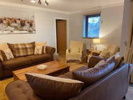 A living room with a sofa and armchairs at Blairgowrie Luxury 3 Bed Lodge with Hot Tub in Blairgowrie