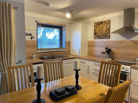 A kitchen with dining area and appliances at Blairgowrie Luxury 3 Bed Lodge with Hot Tub in Blairgowrie