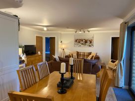 A dining room with a table and chairs at Blairgowrie Luxury 3 Bed Lodge with Hot Tub in Blairgowrie