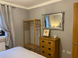 A bedroom with a mirror and chest of drawers at Blairgowrie Luxury 3 Bed Lodge with Hot Tub, Blairgowrie
