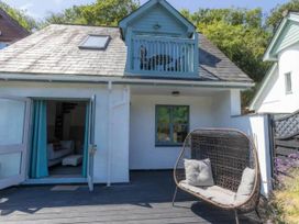 An outdoor area with a balcony and seating at 2 Bedrooms overlooking Little Petherick Creek Little Petherick