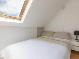 A bedroom with a bed and skylight at 2 Bedrooms overlooking Little Petherick Creek Little Petherick