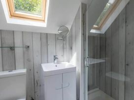 A bathroom with a shower and sink at 2 Bedrooms overlooking Little Petherick Creek in Little Petherick