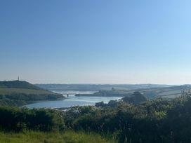 A view of a river and bridge surrounded by hills at 2 Bedrooms overlooking Little Petherick Creek Little Petherick