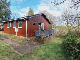 A house with a deck and windows in Woolsery near Bideford