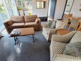 A living room with a sofa and coffee table at Forest Retreat Sleeps 4 2Bed with Parking in Woolsery near Bideford