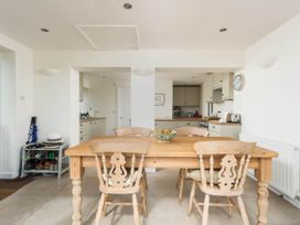 A kitchen with a table and chairs at Stunning 3 Bedroom Cottage near Historic York Ampleforth