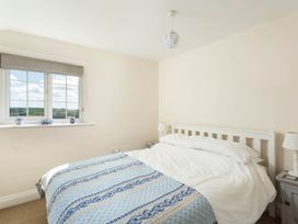 A bedroom with a bed and window at Stunning 3 Bedroom Cottage near Historic York Ampleforth