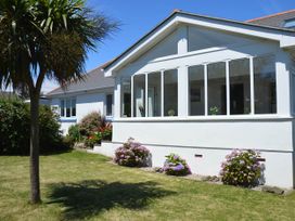A house with a garden and flowers at House Sleeps 8 Close to Beach Free parking in Mullion