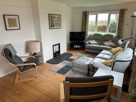 A living room with seating and television at House Sleeps 8 Close to Beach Free parking, Mullion