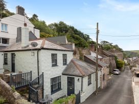 An exterior view of a building with a balcony at Cottage Sleeps 6 Pet friendly Patio in Saint Austell