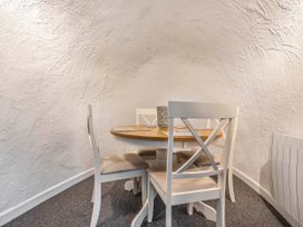 A dining room with a table and chairs at Cottage Sleeps 6 Pet friendly Patio in Saint Austell