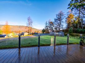 An outdoor area with decking and trees at Dunoon 3Bed Lodge Sleeps 6 Pet Friendly near Dunoon