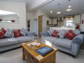 A living room with sofas and a coffee table at Lakeland Lodge 3Bed 2 Bath Private Patio Carnforth