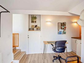 An office space with a desk and chair at Cottage Sleeps 5 with Parking and Garden in Carreglefn