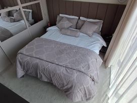 A bedroom with a bed and pillows at Malton 2Bed Lodge Sleeps 4 Pet Friendly Malton