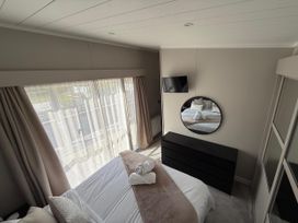A bedroom with a bed and television at Malton 2Bed Lodge Sleeps 4 Pet Friendly, Malton