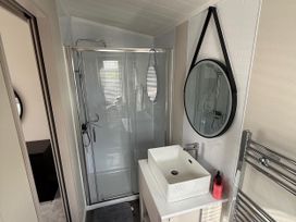 A bathroom with a shower and sink at Malton 2Bed Lodge Sleeps 4 Pet Friendly, Malton