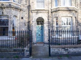 An entrance with a blue door and windows at York Minster 3bed Sleeps 6 Fireplace Free Parking in York