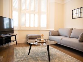 A living room with a sofa and coffee table at York Minster 3bed Sleeps 6 Fireplace Free Parking in York