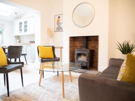 A living room with a coffee table and wood stove at York Minster 3bed Sleeps 6 Fireplace Free Parking in York