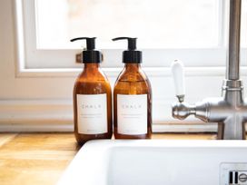 Hand soap and body lotion on a sink at York Minster 3bed Sleeps 6 Fireplace Free Parking, York