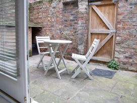 An outdoor area with a table and chairs at York Minster 3bed Sleeps 6 Fireplace Free Parking, York