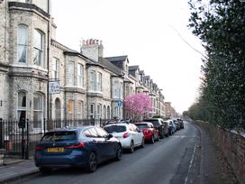 A street lined with houses and parked cars at The Park View in York