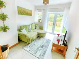A living room with a sofa and tv at 4 Bed Villa Sleeps 8 Private Terrace Free parking Near St Austell