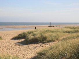 A beach with sand dunes and ocean view at Sandy Paws Dog Friendly Anderby Creek