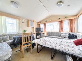 A living room with a dining table and sofa at 3 Bed Caravan Sleeps 8 Pets Garden Parking Hull