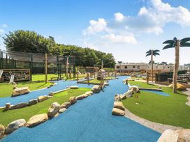 An outdoor play area with pathways and playground structures at 3 Bed Caravan Sleeps 8 Pets Garden Parking in Hull