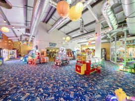 An arcade filled with various game machines at 3 Bed Caravan Sleeps 8 Pets Garden Parking Hull