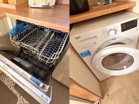 A dishwasher and washing machine in a laundry room at 