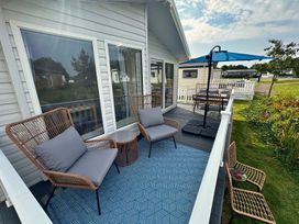 An outdoor seating area with chairs and an umbrella at the property