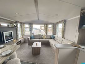 A living room with a sofa and coffee table at  in Builth Wells