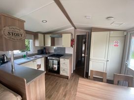 A kitchen with a stove and sink at a property