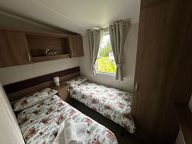 A bedroom with two beds and a window at 