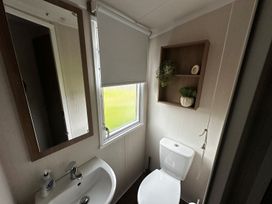 A bathroom with a sink and toilet at The Old Barn in Manchester